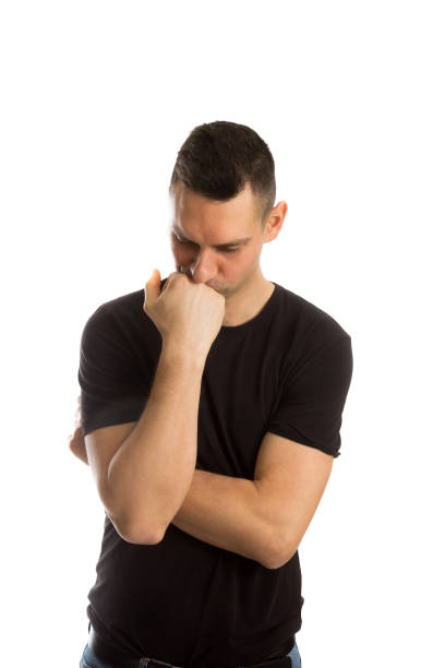 istock Photo of thoughtful man isolated over white background wall. 1214919226
