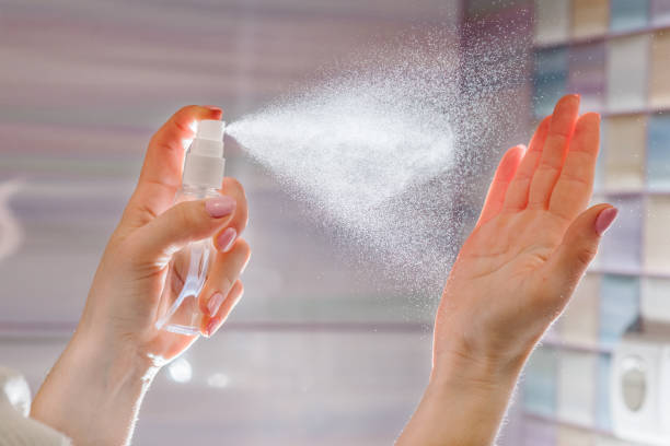 istock Hands applying alcohol spray or anti bacteria spray. Personal hygiene concept. Coronavirus. Cleaning hands with sanitizer gel. Prevent the spread of germs and avoid infections coronavirus. 1214919521