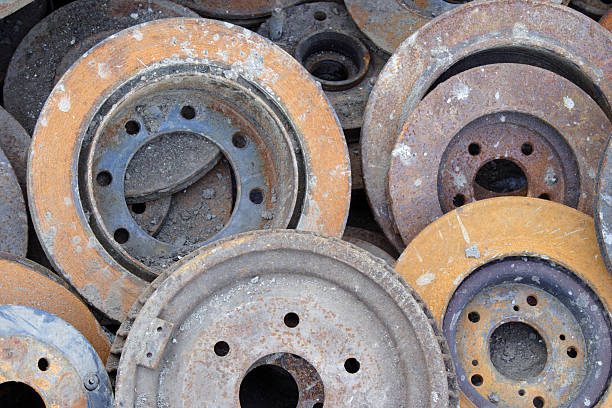 istock Pile of Rusty Junkyard Disc Brakes 121492078