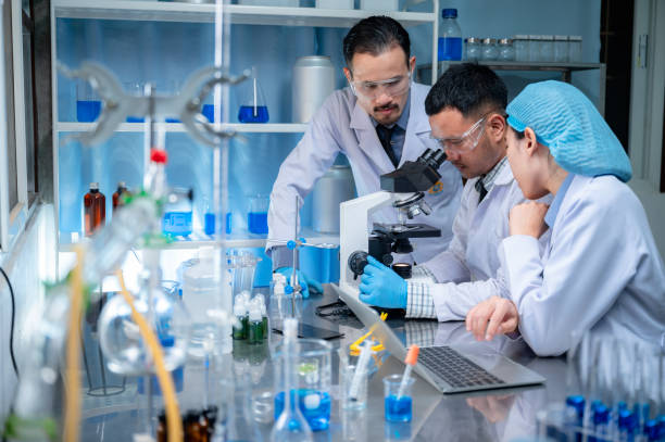 istock Science and medicine, scientist analyzing and dropping a sample into a glassware, experiments containing chemical liquid in laboratory on glassware, DNA structure, innovative and technology. 1214921160