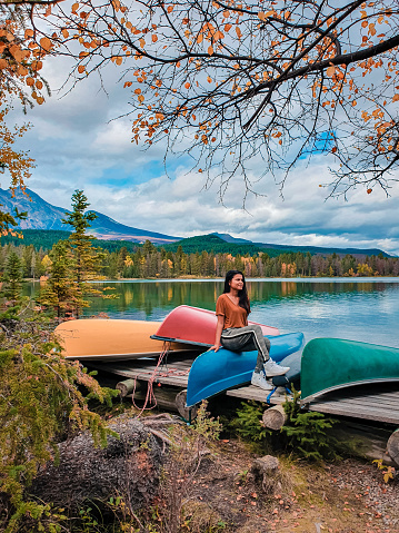 Jasper town Canada, girl at lakeshore, sunrise by the lake at Jasper , Lac Beauvert Alberta Canadian Rockies Canada vacation