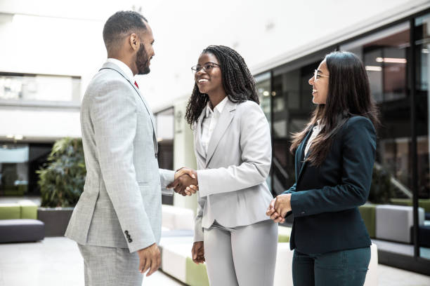 istock Happy diverse business partners greeting each other 1214922786