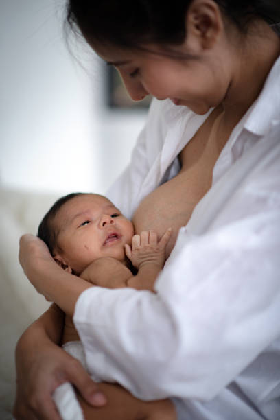 istock Adolescent mother is breastfeeding a baby. 1214923076
