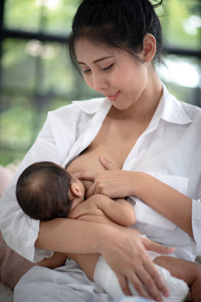 istock Adolescent mother is breastfeeding a baby. 1214923126