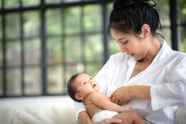 istock Adolescent mother is breastfeeding a baby. 1214923249