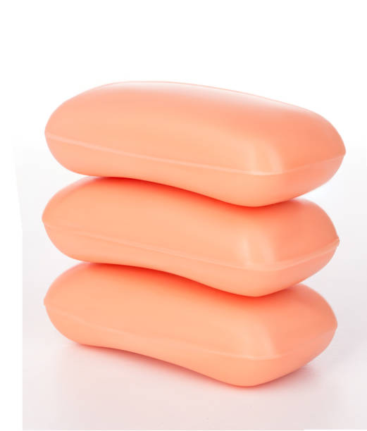 istock Pieces of orange soap isolated on white background. 1214923334