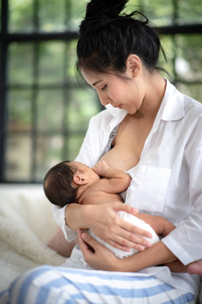 istock Adolescent mother is breastfeeding a baby. 1214923426