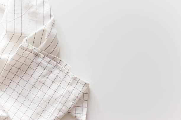 istock White striped and checkered tablecloth close-up, isolated on white with copy space 1214926134