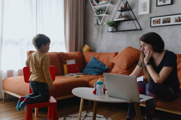 istock Single mother staying home with son. 1214926191