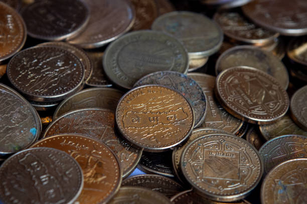 istock Piles of Nepal Rupee Coins 1214926373
