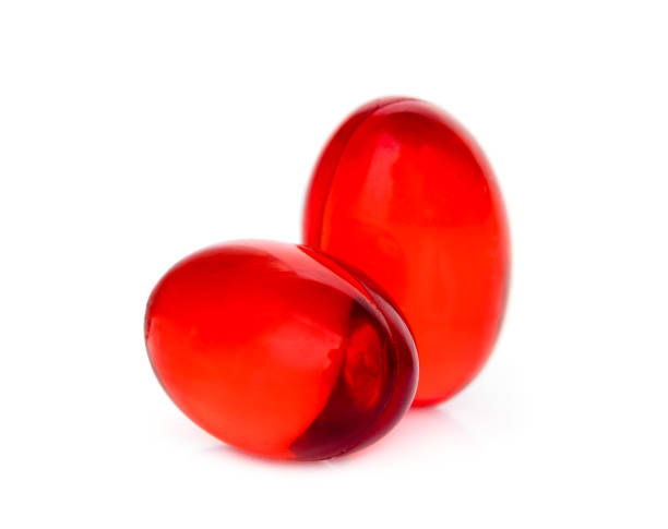 istock two red soft gel capsule isolated on white background 1214927217