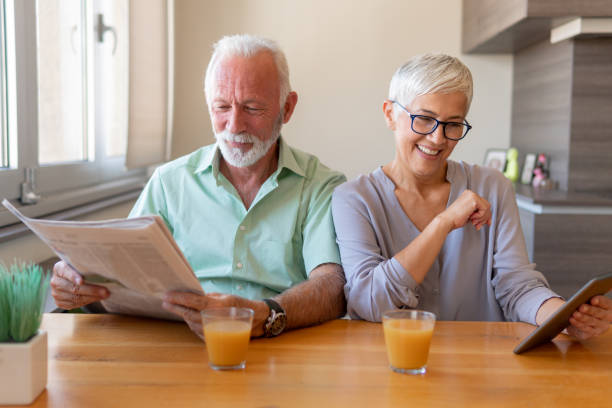 istock Senior couple working from home 1214930126