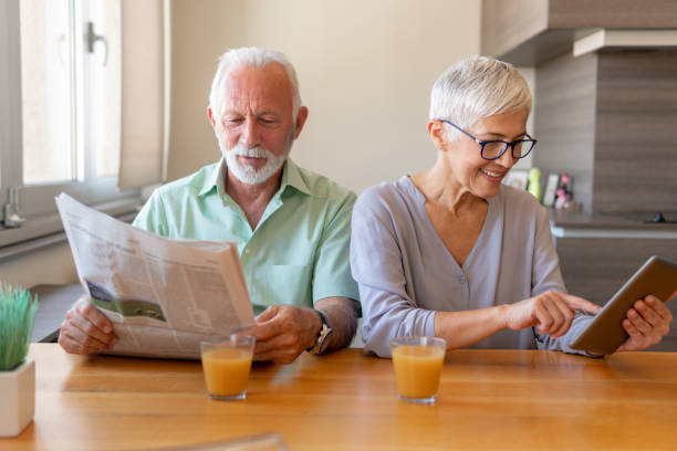 istock Senior couple working from home 1214930176