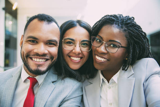 istock Happy joyful diverse business colleagues taking selfie 1214930232