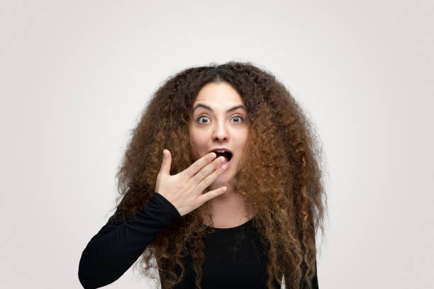 istock Portrait of shocked young man over white background 1214930455