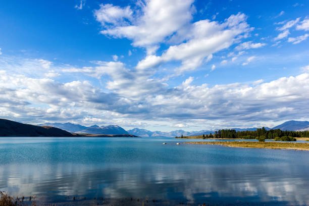 istock Beautiful Lake Tekapo with mountain range in the Background on a sunny day with withe clouds, South Island, New Zealand 1214931873