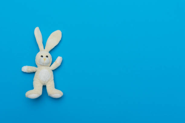 istock Toy Bunny On Blue Background. World Autism Awareness 1214932749