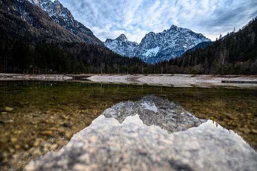 reflection of the treetops and ripples on the water of the lake