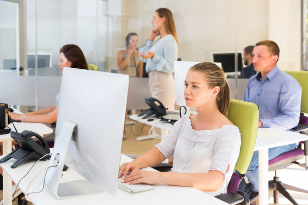 istock Ordinary businesswoman concentrated on work 1214932994