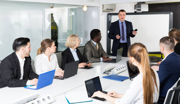 istock male discussing new business project with  team 1214933059