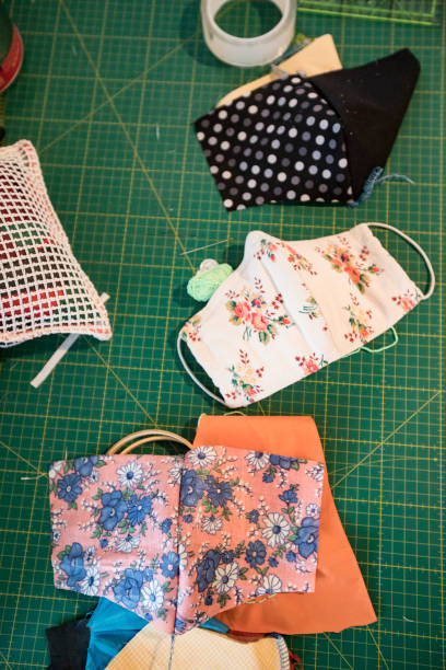 Sewing Homemade Protective Face Masks from Textile - Stock Photo