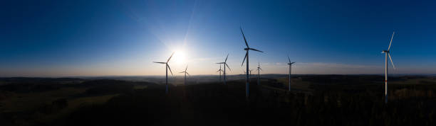 istock wind wheels in the evening high definition panorama 1214939276