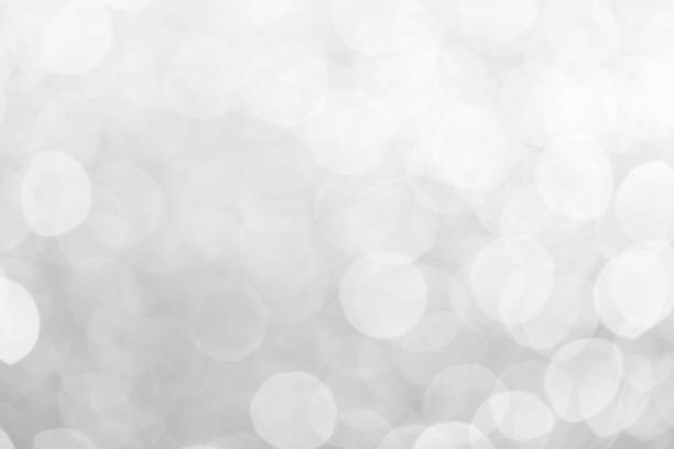 istock white blur abstract background. Gray and white bokeh from natural 1214939551