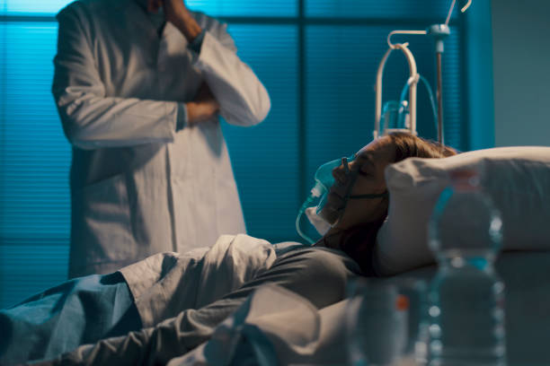 istock Professional doctor checking a patient at night 1214939707
