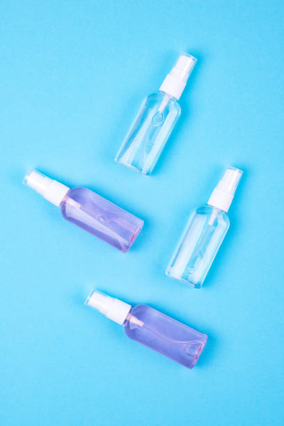 istock Antibacterial antiseptic spray for hands sanitizer on blue background.Prevention against virus, bacteria or coronavirus. 1214942667