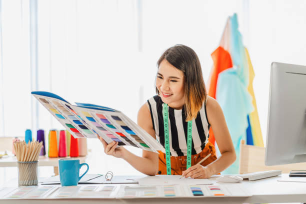 istock Fashion Designer Holding Chart In Studio 1214945143