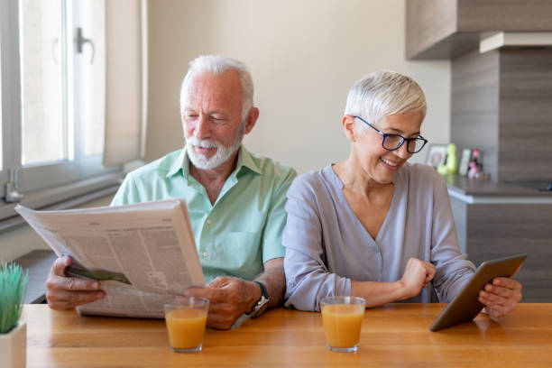 istock Senior couple working from home 1214945685