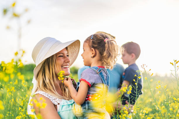 istock Young happy family enjoying nature 1214945705
