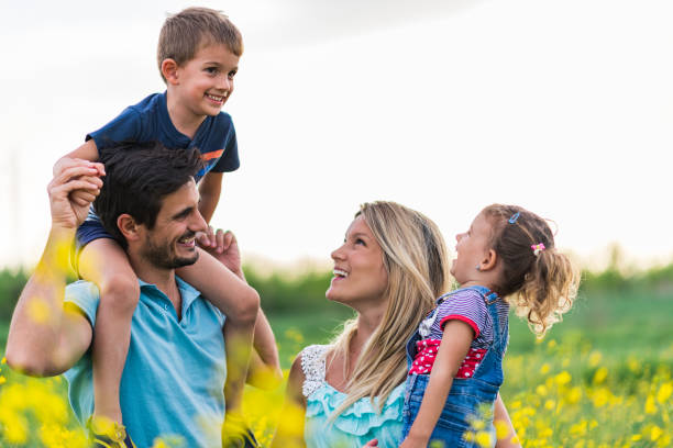 istock Young happy family enjoying nature 1214945766
