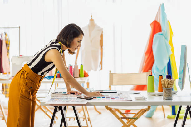 istock Side View Of Fashion Designer Working In Studio 1214946873