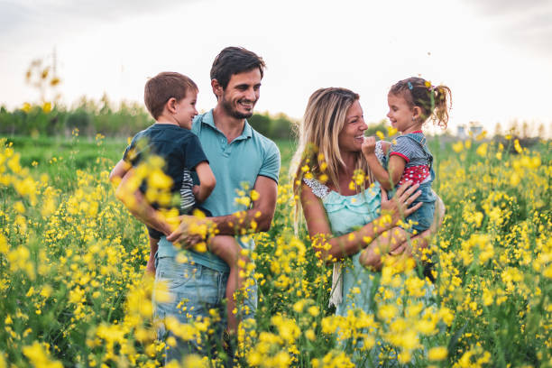istock Young happy family enjoying nature 1214947478
