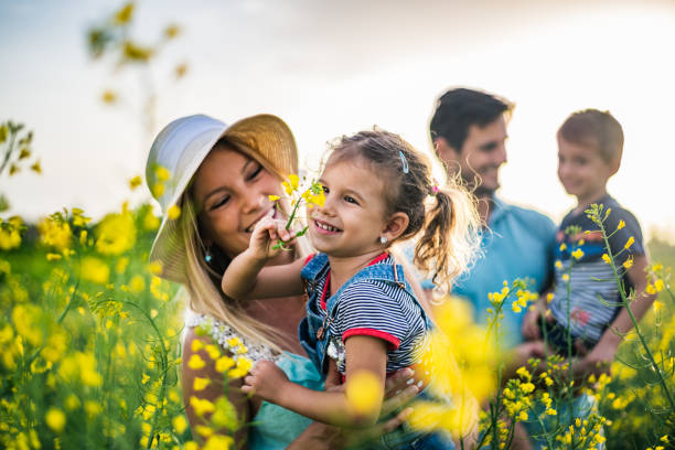 istock Young happy family enjoying nature 1214947548