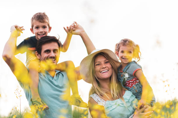 istock Young happy family enjoying nature 1214947968