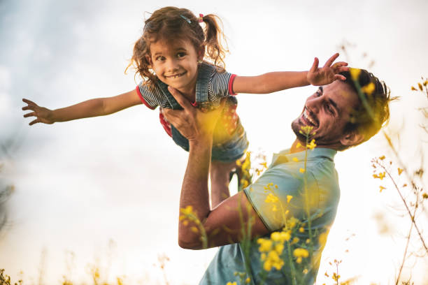 istock Father and daughter enjoying nature 1214948179