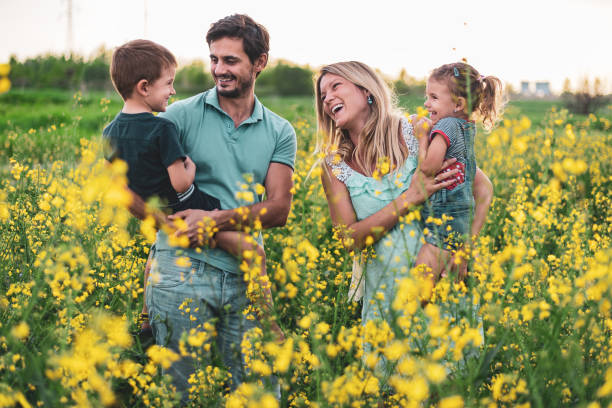istock Young happy family enjoying nature 1214948619