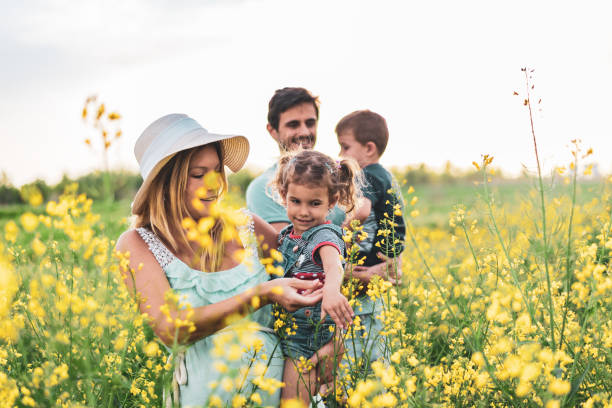 istock Young happy family enjoying nature 1214949381