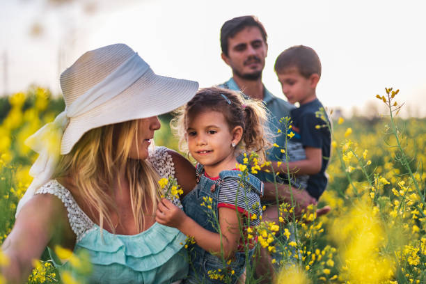 istock Young happy family enjoying nature 1214949512