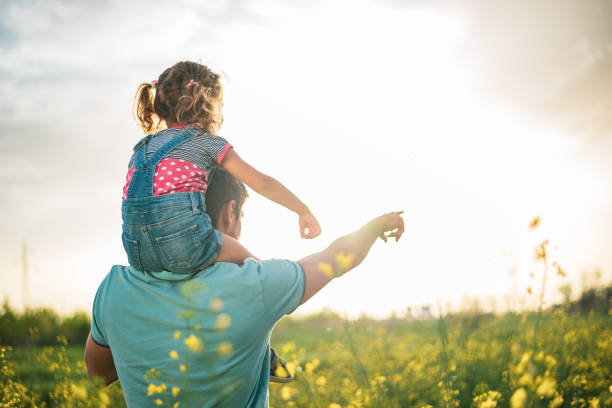 istock Father and daughter enjoying nature 1214949838