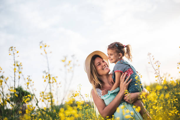 istock Young mother and daughter enjoying nature 1214949894