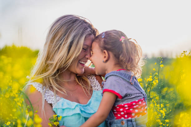 istock Young mother and daughter enjoying nature 1214950406
