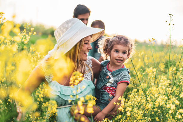istock Young happy family enjoying nature 1214950828