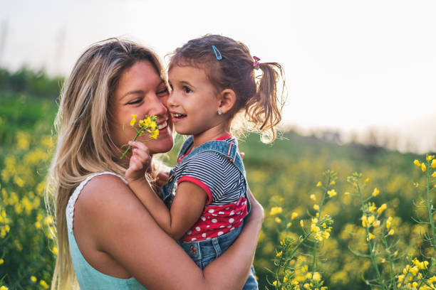 istock Young mother and daughter enjoying nature 1214950949