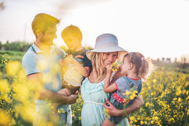 istock Young happy family enjoying nature 1214952084