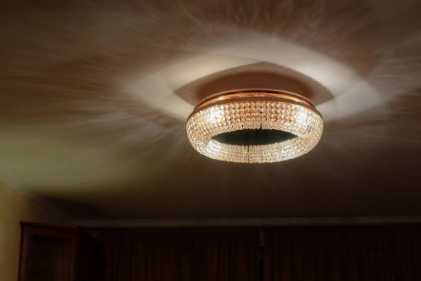 istock Large crystal chandelier glass refracts and reflects light 1214952839