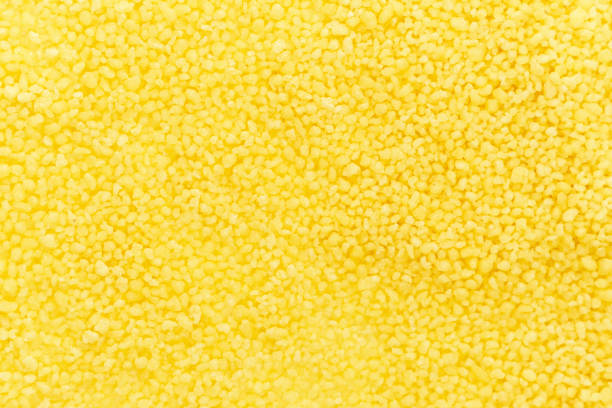 istock croup cous cous close-up. wheat porridge background, texture 1214954058