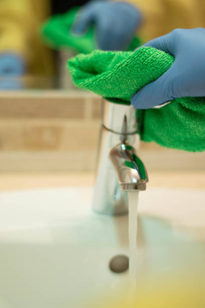 istock Cleaning with spray detergent, rubber gloves and dish cloth 1214954594